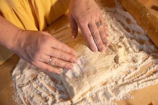 pizza dough preparation flour hands
